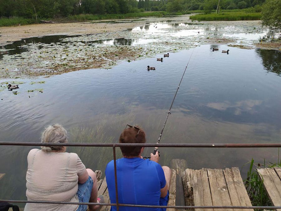 Two women are fishing at the rare Chudo-polyana, Gatchina. Field trip, part of the Chudo-polyana 2.0 project 2020