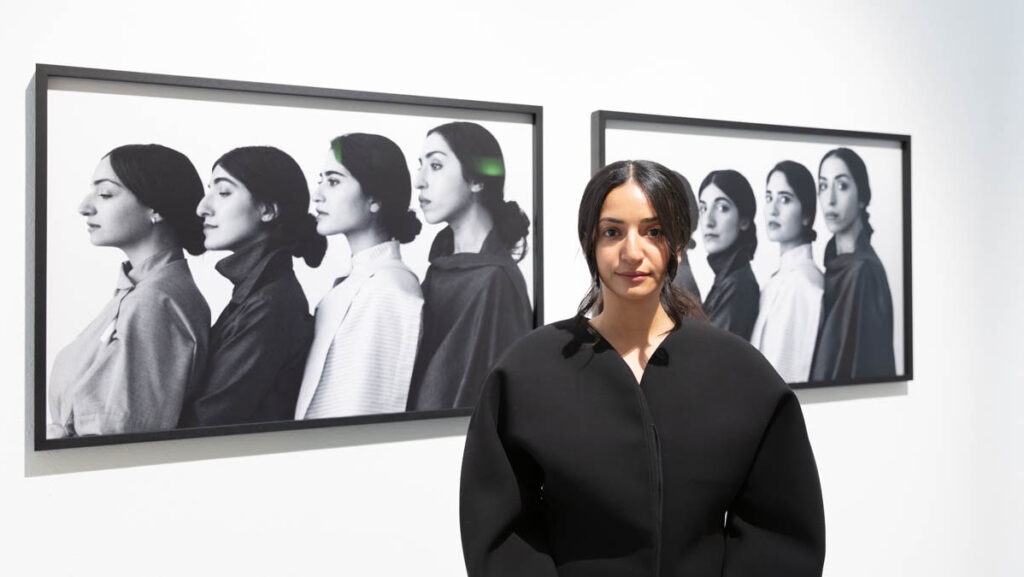 Yumna in front of her work Axis of Evil series (2020). Photo: Courtesy of the artist
