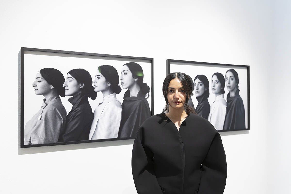 Yumna in front of her work Axis of Evil series (2020). Photo: Courtesy of the artist