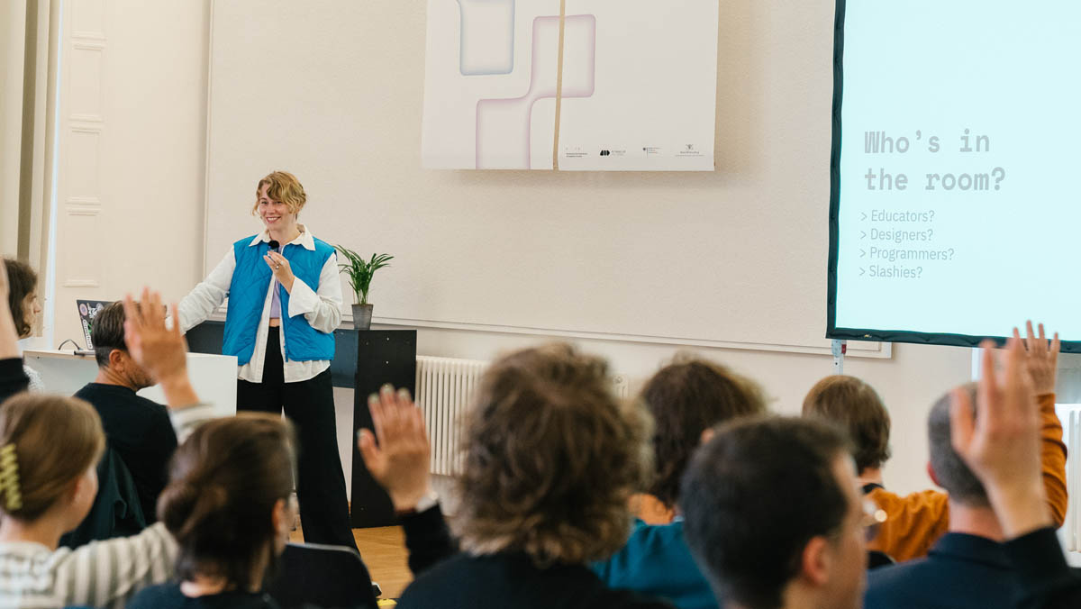 Photo of Nadia speaking at KITeGG Reshape Symposium 2023