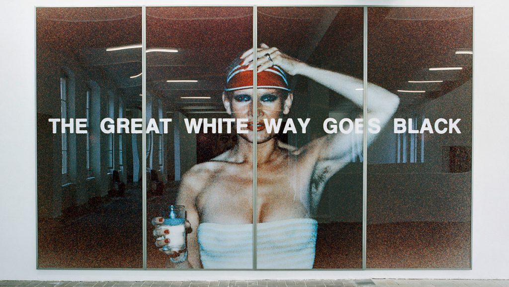Katharina Sieverding, THE GREAT WHITE WAY GOES BLACK, IX, 1977. Color photograph, acrylic, and steel frames, 300 x 500 cm. Installation view of the exhibition: Katharina Sieverding – Close Up, KW Institute for Contemporary Art Berlin, 2005 © Katharina Sieverding, VG Bild-Kunst, Bonn 2021.