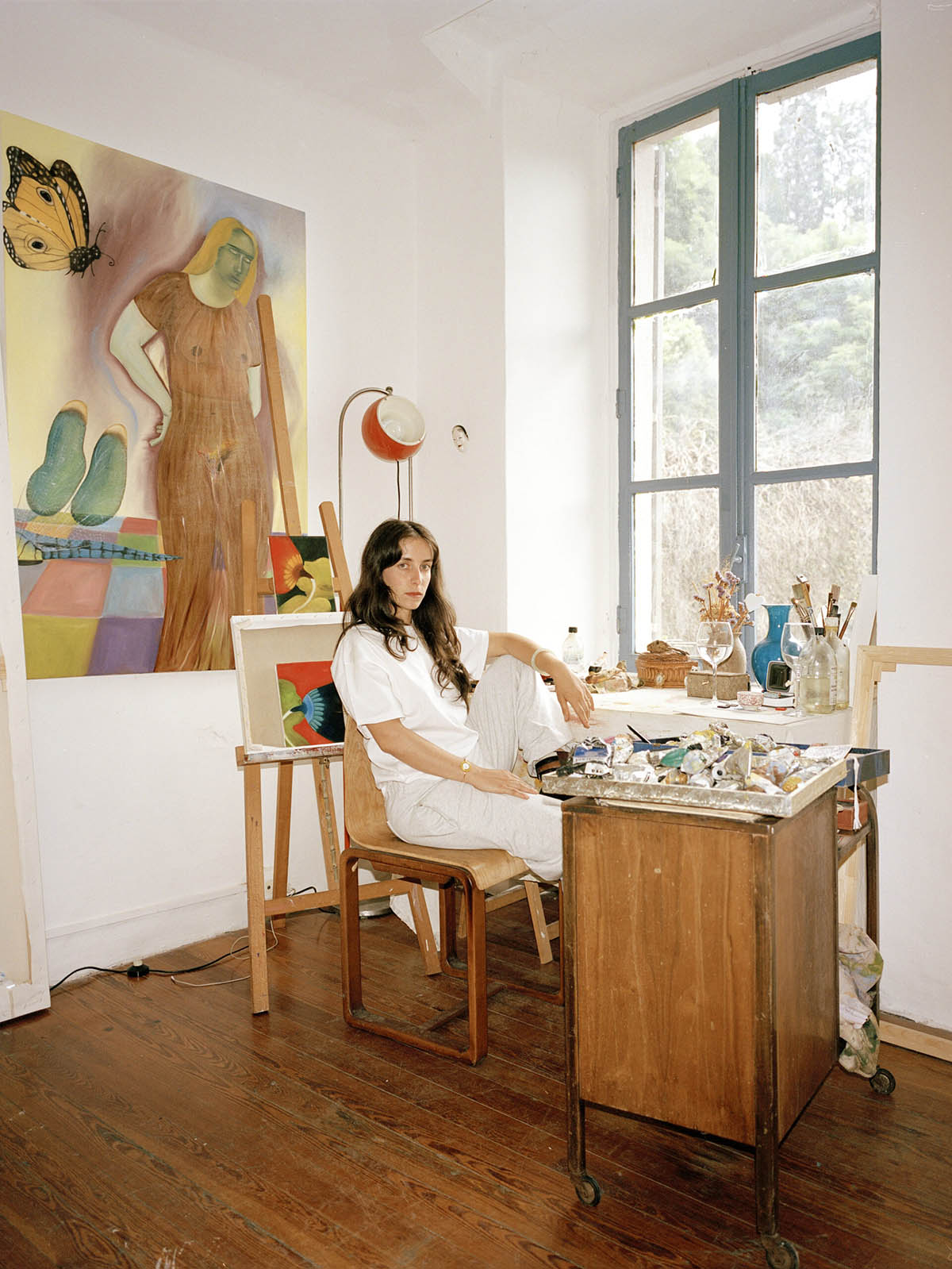 Lula Broglio next to work, Sand and foam, 2023, oil on canvas, 100x140 cm. Photographer: